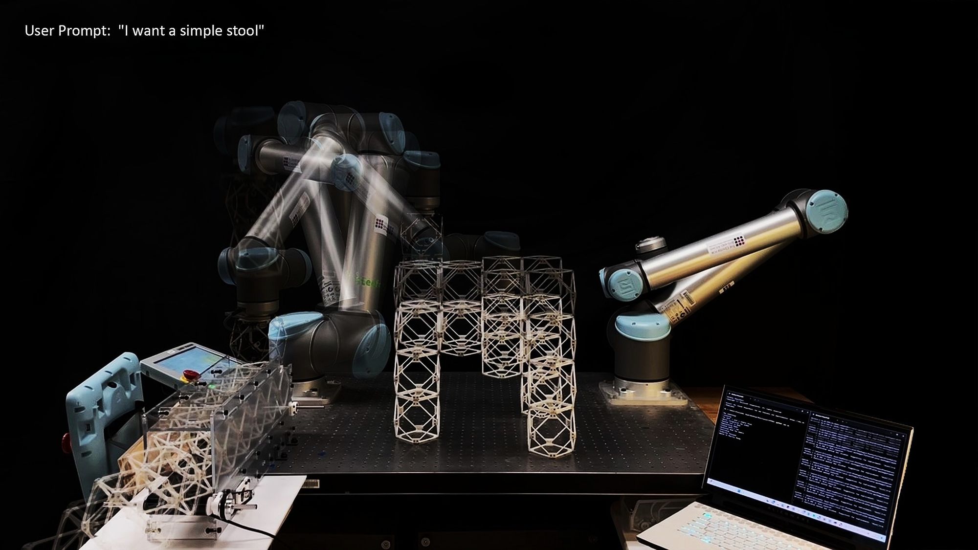 Two robotic arms assemble a geometric stool-like structure made of interlocking lattice components. A motion blur effect captures one arm’s movement as it places parts. A laptop and control panel sit nearby, and text in the corner reads “User Prompt: ‘I want a simple stool.’” The setup demonstrates real-time AI-driven robotic fabrication responding to natural language input.